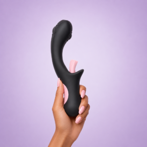 Black and pink Pink Panther dual-stimulation vibrator held against a soft lavender background.